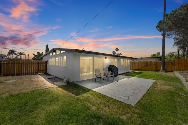 6252 Lake Albano Ave, San Diego, CA 92119 - rear view of house featuring stucco siding, a fenced backyard, and a patio area