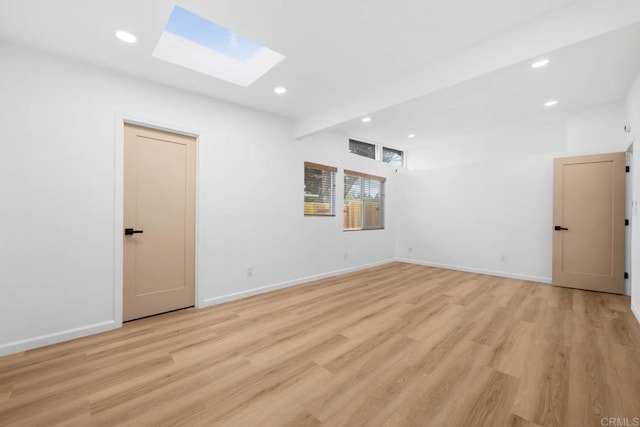 6252 Lake Albano Ave, San Diego, CA 92119 - unfurnished room with a skylight, recessed lighting, and light wood-type flooring
