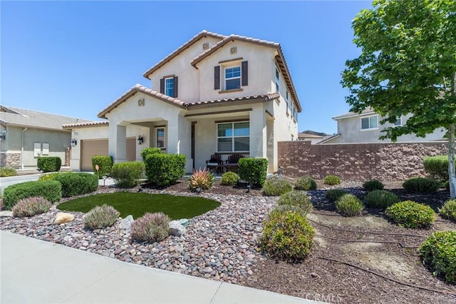 29590 Rawlings Way, Lake Elsinore, CA 92530 - mediterranean / spanish-style home with stucco siding, a garage, a porch, and a tile roof