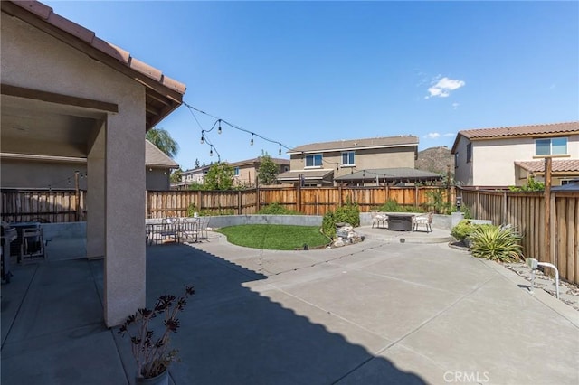 29590 Rawlings Way, Lake Elsinore, CA 92530 - fenced backyard with a patio and a fire pit