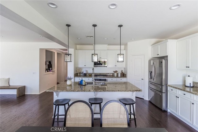 29590 Rawlings Way, Lake Elsinore, CA 92530 - kitchen featuring stainless steel appliances, dark wood-style floors, a kitchen breakfast bar, white cabinets, and recessed lighting