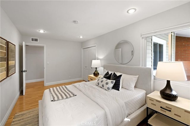 2662 Salmon Dr, Los Alamitos, CA 90720 - bedroom with light wood finished floors, baseboards, recessed lighting, and a closet