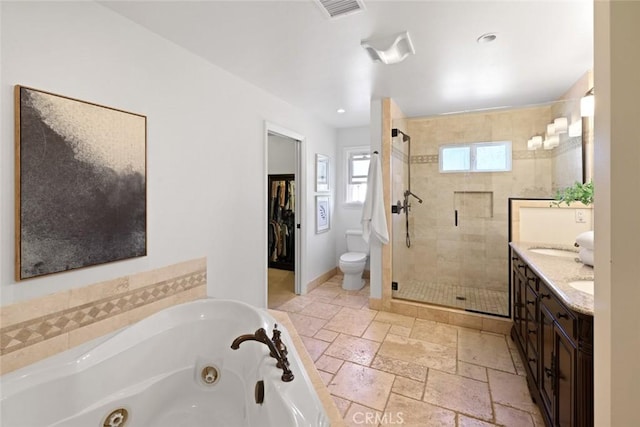 2662 Salmon Dr, Los Alamitos, CA 90720 - full bathroom with a shower stall, a tub with jets, double vanity, stone tile floors, and toilet