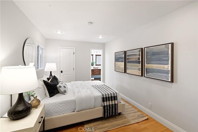 2662 Salmon Dr, Los Alamitos, CA 90720 - bedroom featuring wood finished floors, baseboards, and recessed lighting