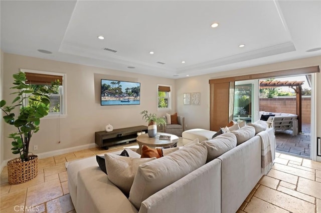 2662 Salmon Dr, Los Alamitos, CA 90720 - living area with a tray ceiling, stone tile flooring, recessed lighting, and baseboards