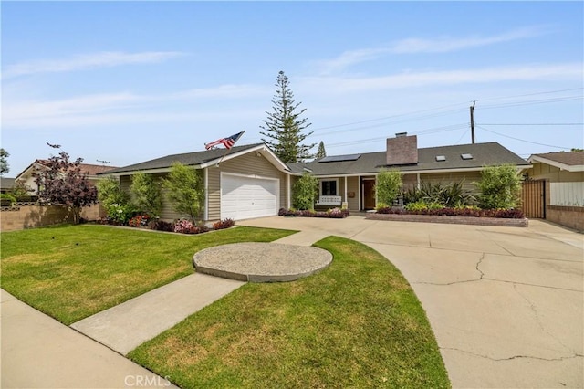 2662 Salmon Dr, Los Alamitos, CA 90720 - single story home with solar panels, concrete driveway, a chimney, and an attached garage