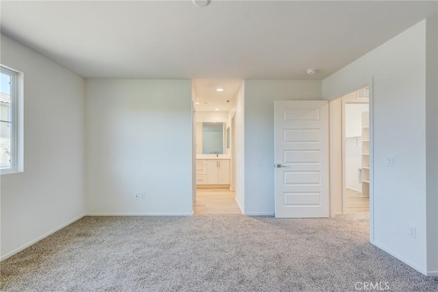 13119 Lancaster St, Hesperia, CA 92344 - unfurnished bedroom featuring carpet floors, baseboards, and connected bathroom