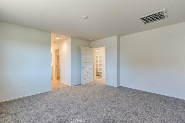 13119 Lancaster St, Hesperia, CA 92344 - unfurnished bedroom with light carpet, baseboards, a spacious closet, and recessed lighting