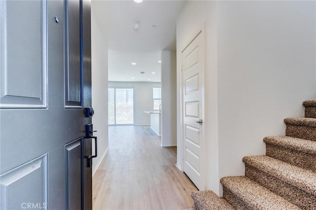13119 Lancaster St, Hesperia, CA 92344 - entryway with light wood-style flooring, stairs, recessed lighting, and baseboards