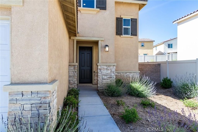 13119 Lancaster St, Hesperia, CA 92344 - view of exterior entry featuring stucco siding and stone siding