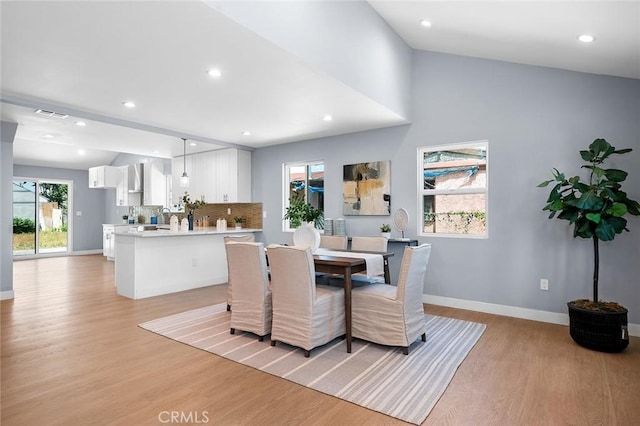 1223 W 90th St, Los Angeles, CA 90044 - dining room with light wood finished floors, baseboards, and recessed lighting