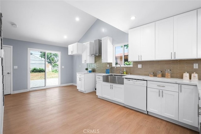 1223 W 90th St, Los Angeles, CA 90044 - kitchen featuring white dishwasher, a sink, wall chimney exhaust hood, backsplash, and vaulted ceiling