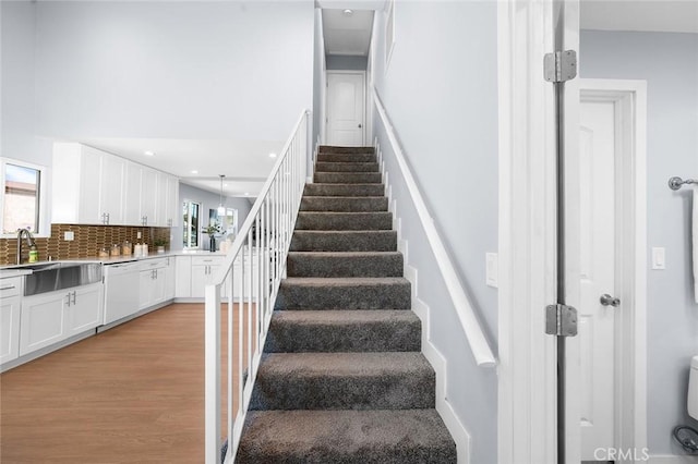 1223 W 90th St, Los Angeles, CA 90044 - stairs with wood finished floors and recessed lighting