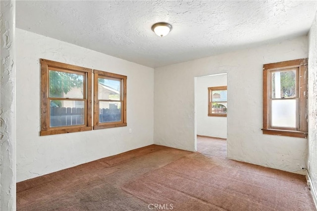 541 Randolph St, Pomona, CA 91768 - spare room featuring a textured ceiling, carpet flooring, and a textured wall