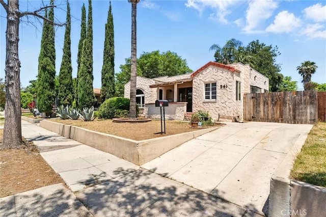 541 Randolph St, Pomona, CA 91768 - mediterranean / spanish home with stone siding and driveway