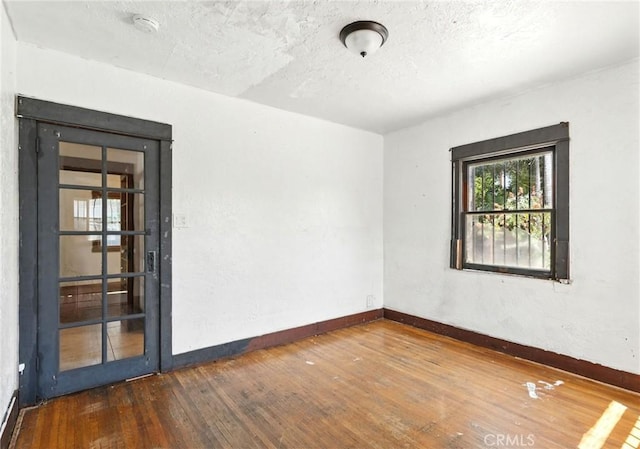 541 Randolph St, Pomona, CA 91768 - unfurnished room featuring hardwood / wood-style floors and a textured ceiling