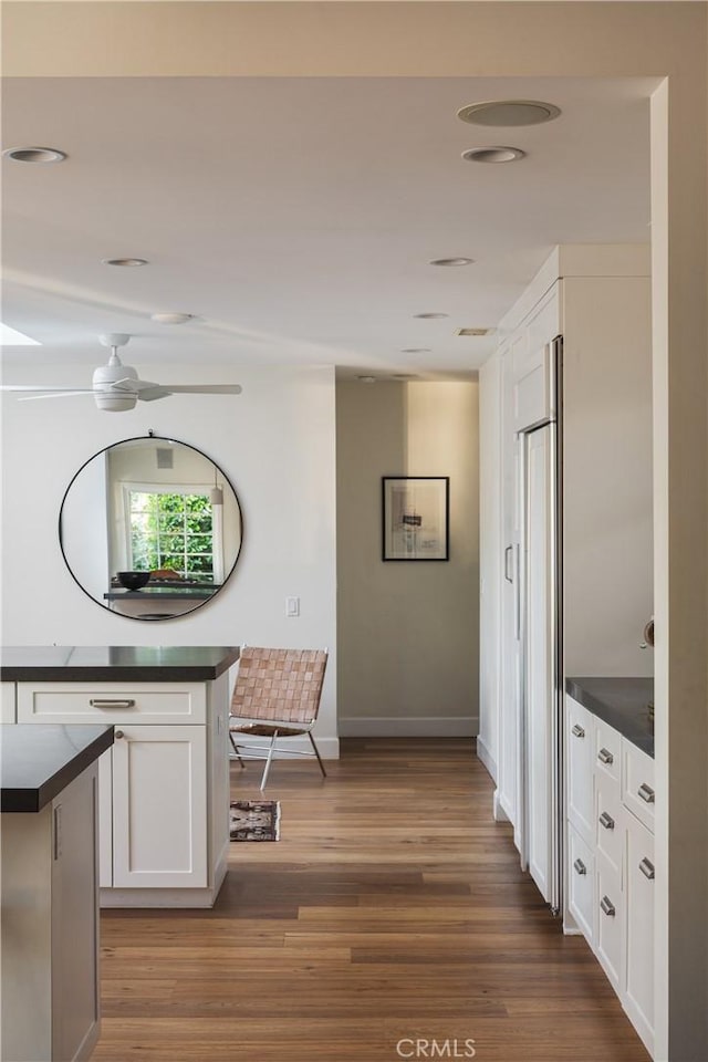 1307 Oxford Ln, Newport Beach, CA 92660 - corridor with wood finished floors, baseboards, and recessed lighting