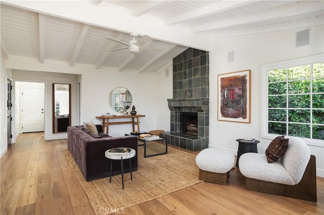 1307 Oxford Ln, Newport Beach, CA 92660 - living room featuring wood finished floors, ceiling fan, a tiled fireplace, and baseboards