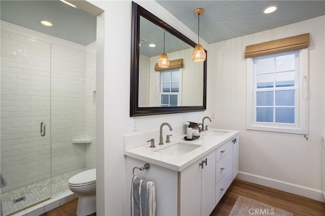 1307 Oxford Ln, Newport Beach, CA 92660 - bathroom with wood finished floors, baseboards, a shower stall, double vanity, and recessed lighting