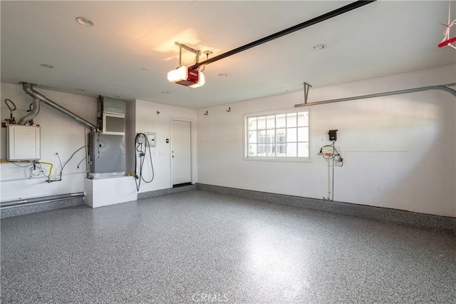 1307 Oxford Ln, Newport Beach, CA 92660 - garage with a garage door opener, heating unit, and baseboards