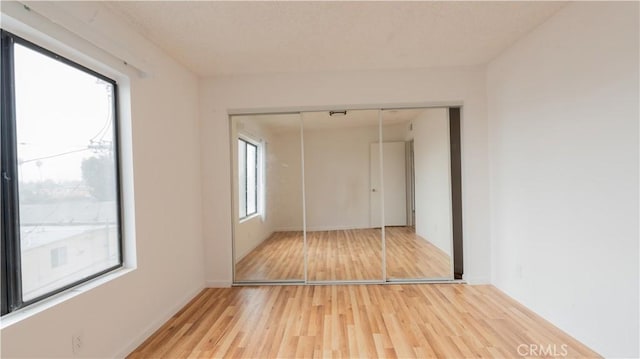14610 Erwin St, Van Nuys, CA 91411 - unfurnished bedroom with light wood-style floors, a closet, and baseboards