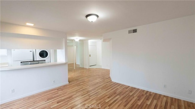 14610 Erwin St, Van Nuys, CA 91411 - unfurnished living room with light wood finished floors and baseboards