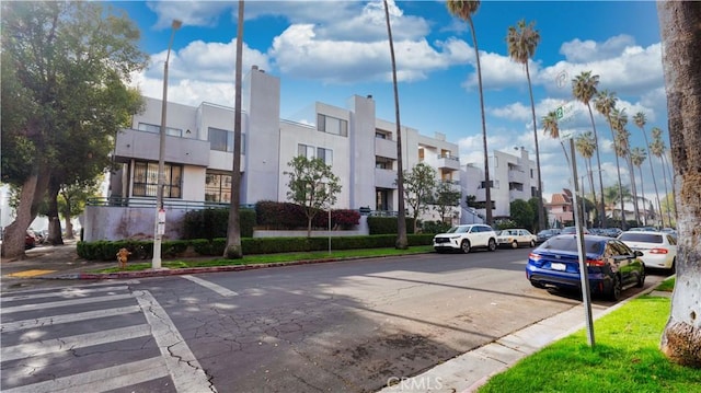 14610 Erwin St, Van Nuys, CA 91411 - view of asphalt road with curbs, a residential view, and sidewalks
