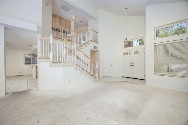 24177 Morning Dove Ln, Murrieta, CA 92562 - entrance foyer featuring stairway, carpet floors, high vaulted ceiling, and baseboards