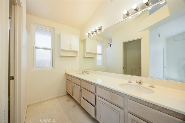 24177 Morning Dove Ln, Murrieta, CA 92562 - bathroom featuring healthy amount of natural light, double vanity, and baseboards