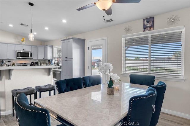 21044 Wisteria St, Apple Valley, CA 92308 - dining area featuring ceiling fan, baseboards, light wood-style flooring, and recessed lighting