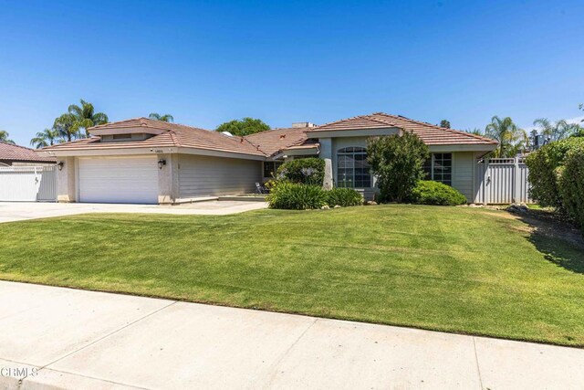 14000 Castlemaine Ave, Bakersfield, CA 93314 - view of front facade featuring driveway, a gate, a garage, and a tiled roof