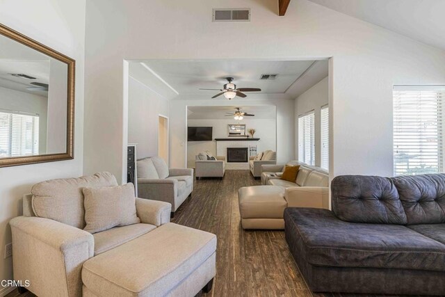 14000 Castlemaine Ave, Bakersfield, CA 93314 - living area featuring dark wood-type flooring, ceiling fan, lofted ceiling, and a fireplace