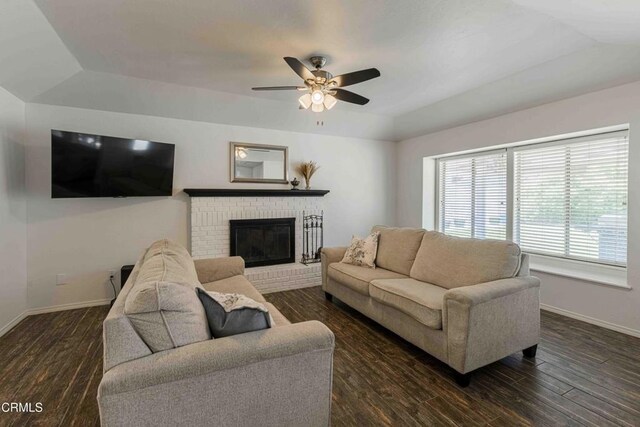 14000 Castlemaine Ave, Bakersfield, CA 93314 - living area featuring a ceiling fan, dark wood-type flooring, lofted ceiling, and a fireplace