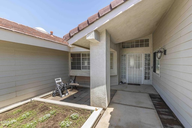 14000 Castlemaine Ave, Bakersfield, CA 93314 - view of exterior entry with a patio