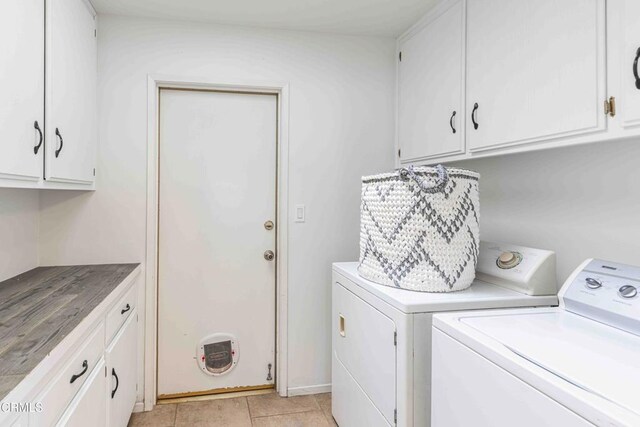 14000 Castlemaine Ave, Bakersfield, CA 93314 - washroom featuring washer and clothes dryer, cabinet space, and light tile patterned flooring