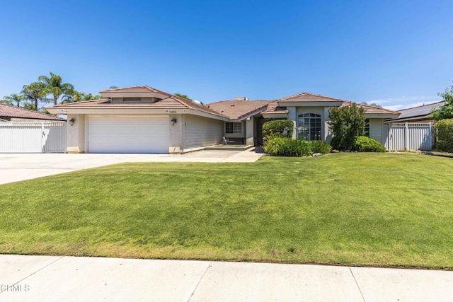 14000 Castlemaine Ave, Bakersfield, CA 93314 - view of front of home with driveway, an attached garage, stucco siding, and a tiled roof