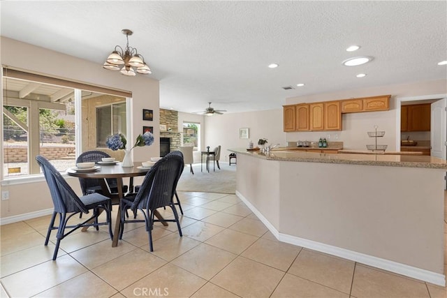 19410 Allegheny Ct, Apple Valley, CA 92307 - dining area featuring recessed lighting, a ceiling fan, baseboards, a textured ceiling, and light tile patterned floors