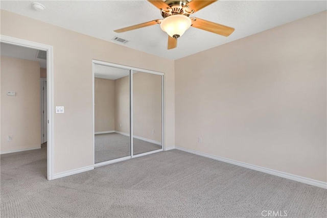19410 Allegheny Ct, Apple Valley, CA 92307 - unfurnished bedroom featuring carpet flooring, baseboards, a closet, and ceiling fan