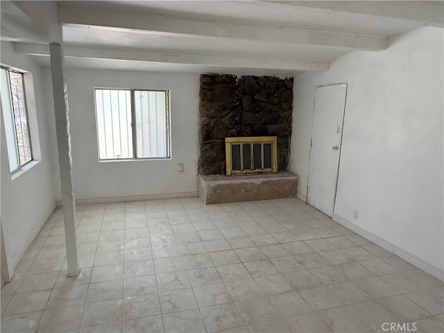 4639 Flora St, Montclair, CA 91763 - unfurnished living room featuring beam ceiling, a fireplace, and baseboards