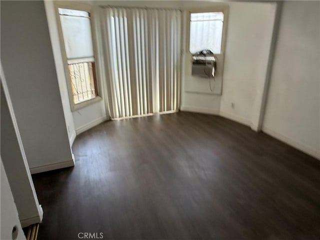 4639 Flora St, Montclair, CA 91763 - empty room featuring baseboards and dark wood-style flooring