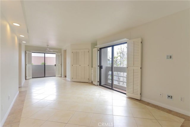 12484 Montecito Rd Unit 484, Seal Beach, CA 90740 - unfurnished room with light tile patterned floors, baseboards, a ceiling fan, and recessed lighting