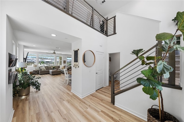32325 Hillstone St, Temecula, CA 92591 - foyer entrance featuring stairway, wood finished floors, baseboards, a ceiling fan, and recessed lighting