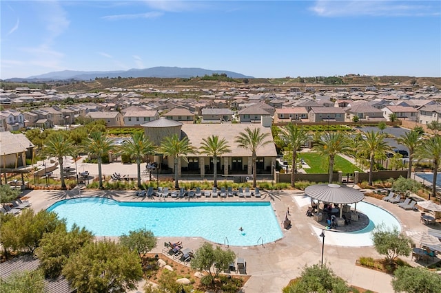 32325 Hillstone St, Temecula, CA 92591 - community pool with a residential view, a mountain view, and a patio area