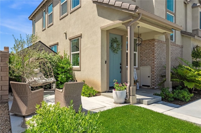 32325 Hillstone St, Temecula, CA 92591 - doorway to property with stucco siding and brick siding