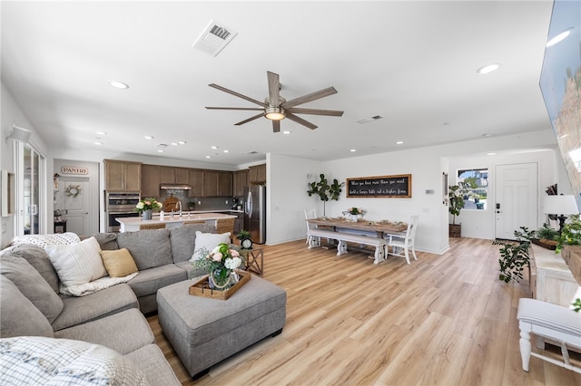 32325 Hillstone St, Temecula, CA 92591 - living area with ceiling fan, recessed lighting, and light wood-type flooring