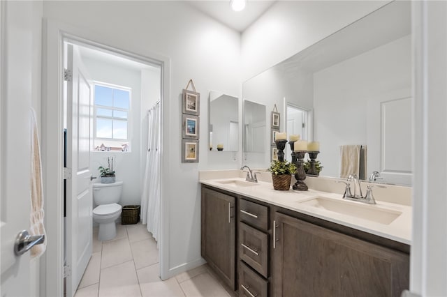 32325 Hillstone St, Temecula, CA 92591 - full bath featuring toilet, double vanity, tile patterned flooring, and baseboards