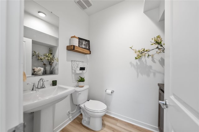 32325 Hillstone St, Temecula, CA 92591 - bathroom with wood finished floors, toilet, and baseboards