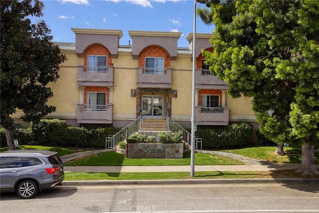 7035 Woodley Ave Unit 204, Van Nuys, CA 91406 - multi unit property with stucco siding and stairway
