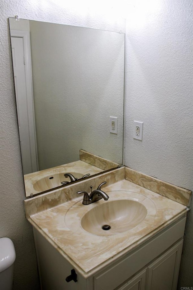 188 S Lincoln Ave Unit 22, El Cajon, CA 92020 - bathroom with vanity, toilet, and a textured wall