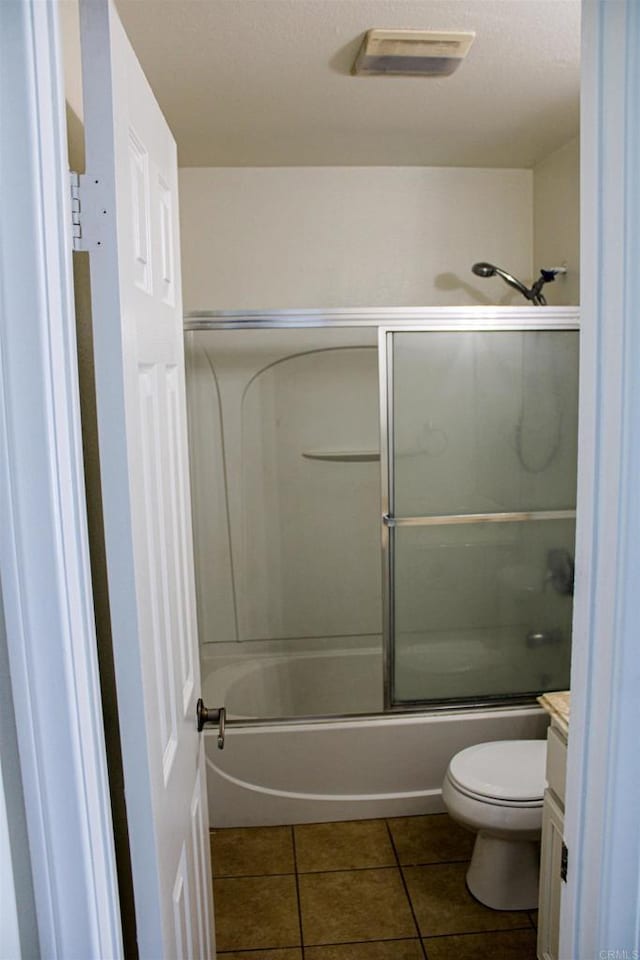 188 S Lincoln Ave Unit 22, El Cajon, CA 92020 - full bathroom featuring toilet, vanity, tile patterned flooring, and bath / shower combo with glass door
